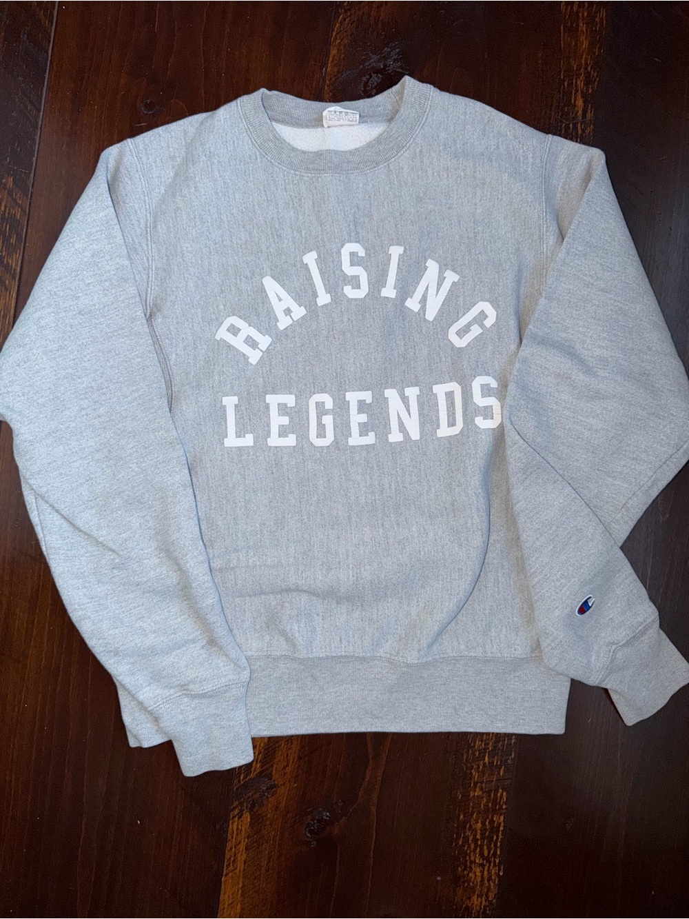Champion Light Gray Crewneck Sweatshirt with "Raising Legends" Print